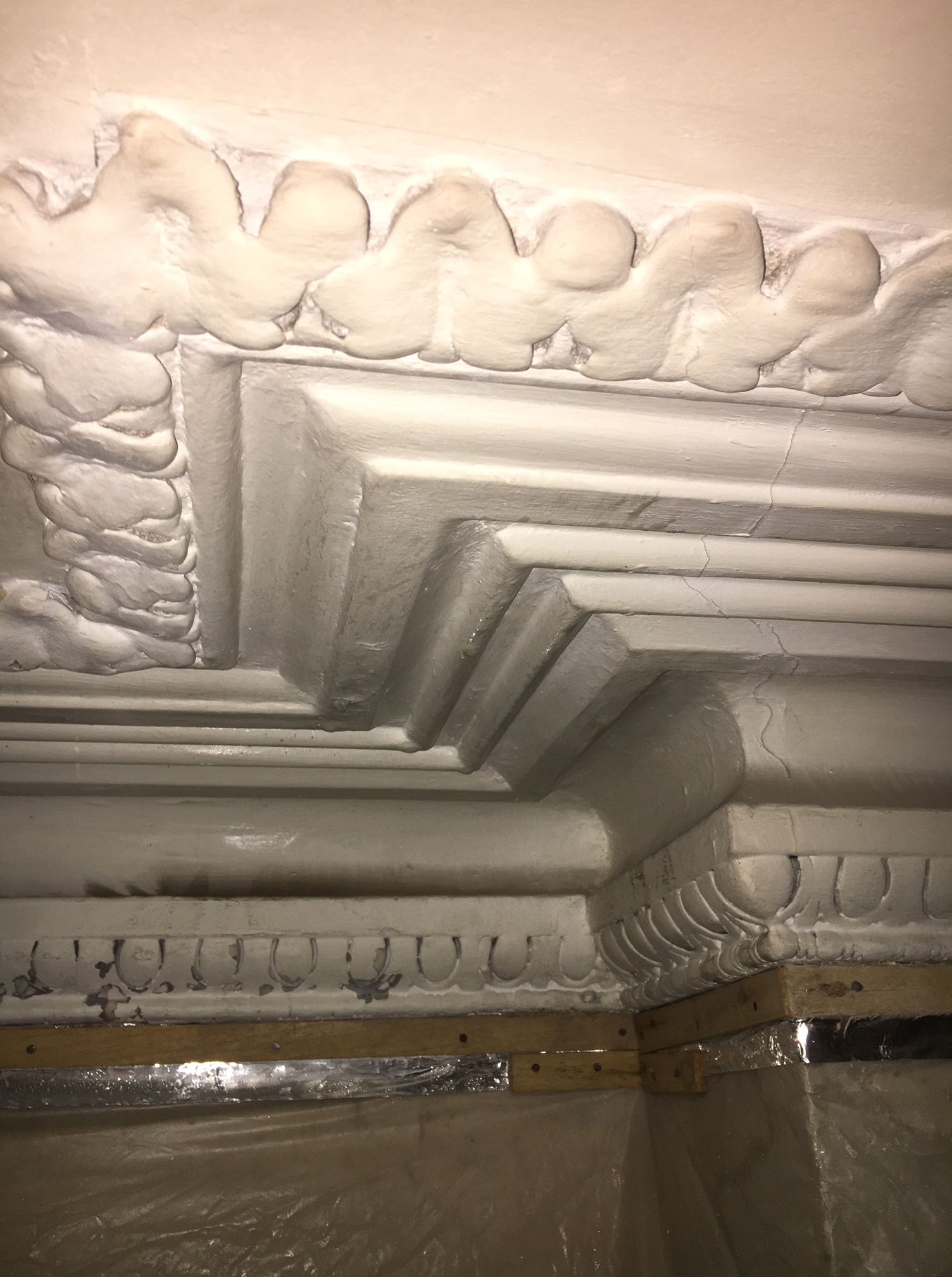 Before restoration: original decorative plaster cornice at a period property in Clissold Crescent, showing years of accumulated paint.